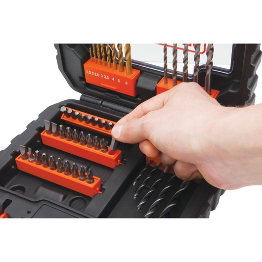 BLACKDECKER A7232 drill and screwdriver bit set in black case, hand selecting a bit, close-up.