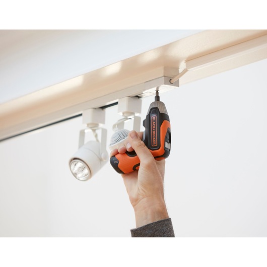 Photo of BLACK+DECKER BCF611CK cordless screwdriver being used to install ceiling light fixture.