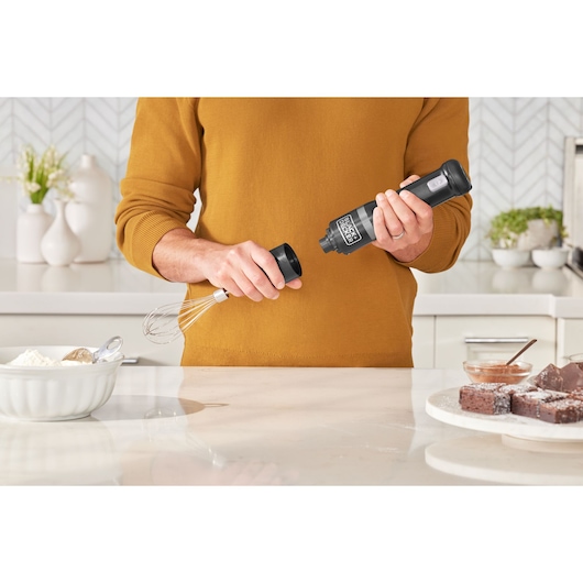 BLACKDECKER hand mixer BCKM1016KSB in kitchen, being assembled with whisk attachment.