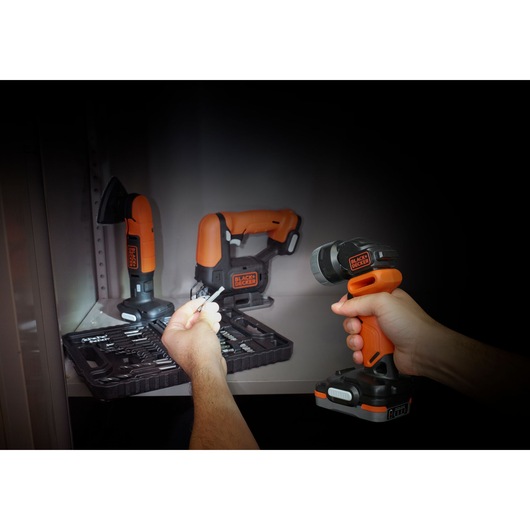 Photo of BLACKDECKER BDCCF12N cordless drill kit with tools and accessories on a shelf.