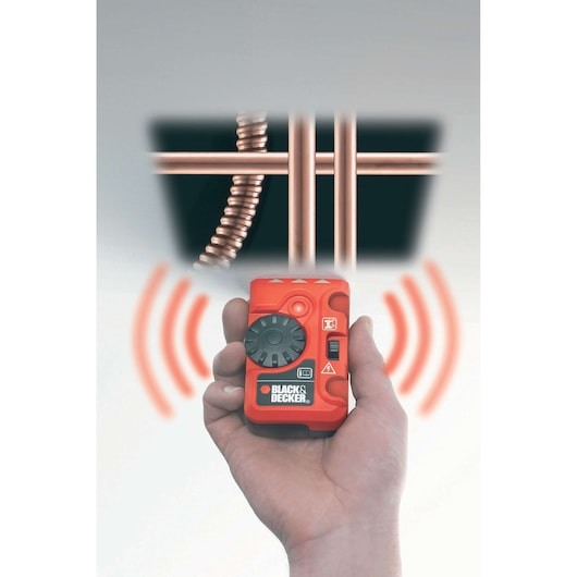 Photo of BLACKDECKER BDS200 wall scanner detecting pipes, held in hand, orange casing, photography front angle.