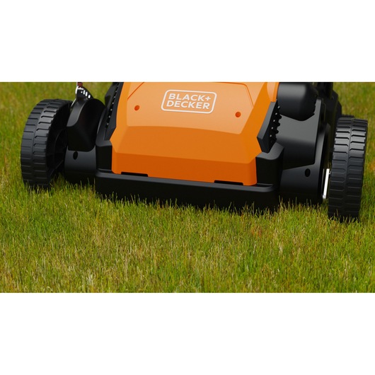 BLACK+DECKER BEOEP320-QS orange and black lawn mower close-up on grass, front angle.