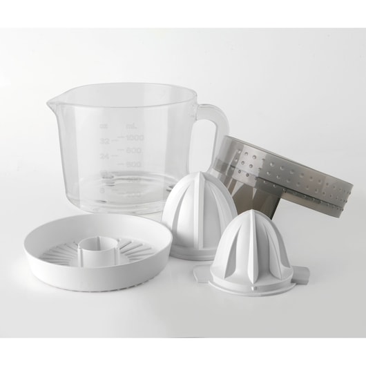 Assorted parts of a citrus juicer are shown, including a clear measuring jug, two white cone-shaped reamers, a white round base, and a grey strainer, all placed on a white surface.