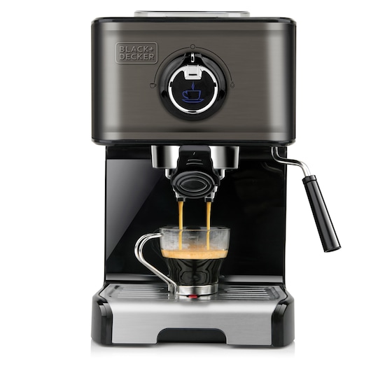 Front view of a BLACK+DECKER espresso machine with a clear glass cup being filled with coffee. The machine has a modern design with a metallic finish and a steam wand on the right side.