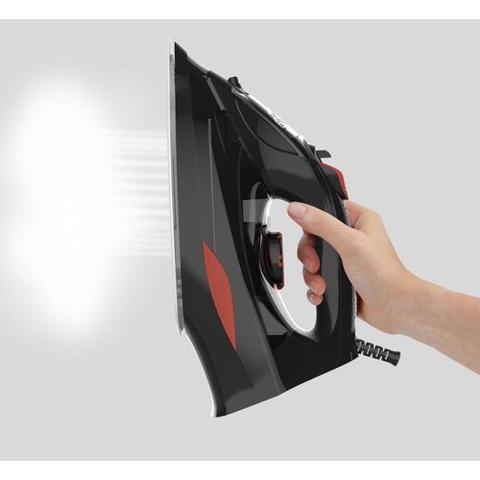 BLACKDECKER BXIR3000E steam iron side view, black and red, hand holding handle, steam coming out.