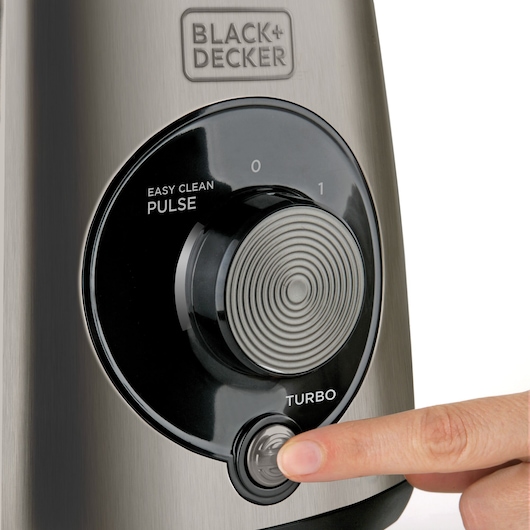 BLACK+DECKER BXJB1000E blender control panel close-up with finger pressing turbo button.