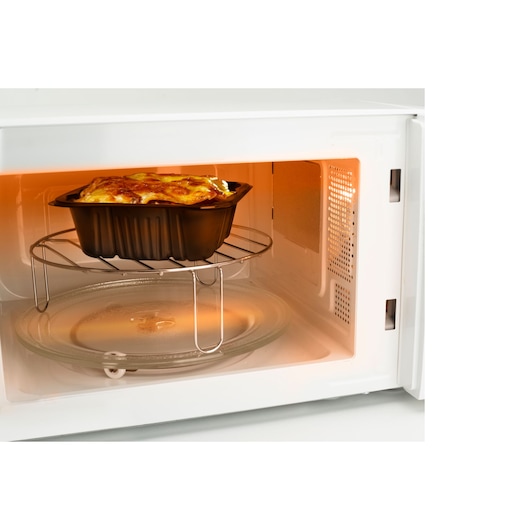 BLACKDECKER BXMZ700E microwave oven interior with lasagna tray on rack, photographed from front angle.