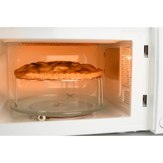 BLACKDECKER BXMZ701E microwave oven interior with a baked pie on a metal rack, front angle.