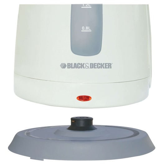Close-up of the base and lower part of a BLACK+DECKER electric kettle, showing the water level markings and the power indicator light.