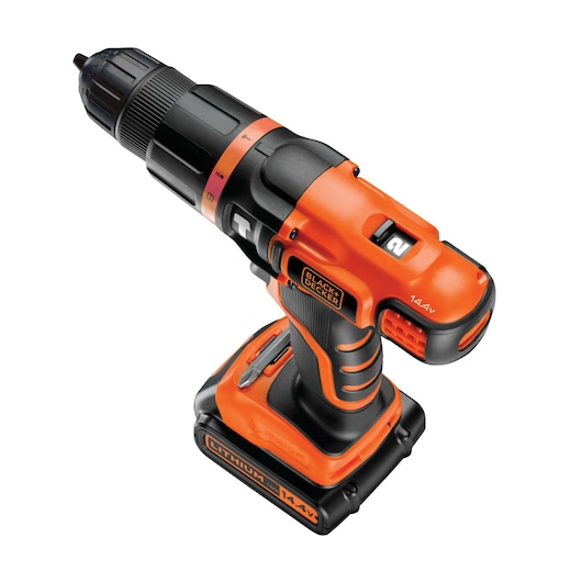 Cordless orange and black power drill with a battery pack, partially obscured by a blurred area.