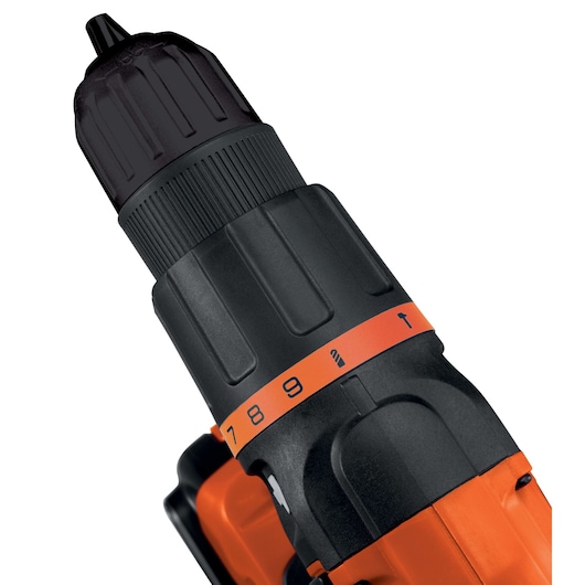Close-up of a BLACK+DECKER cordless drill, showing the adjustable torque settings and part of the orange and black body.