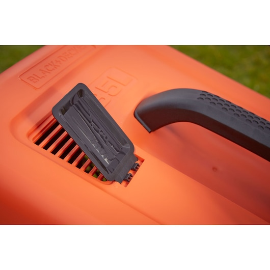 Close-up photo of BLACKDECKER EMAX32S lawn mower handle and vent with black lever on orange housing.