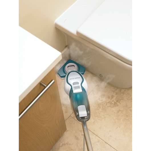 BLACKDECKER FSM1616 steam mop cleaning tile floor near toilet, top-down angle, white and blue design.