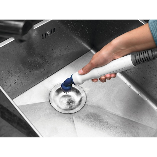 BLACKDECKER FSMHBA handheld cleaning brush used in stainless steel sink.