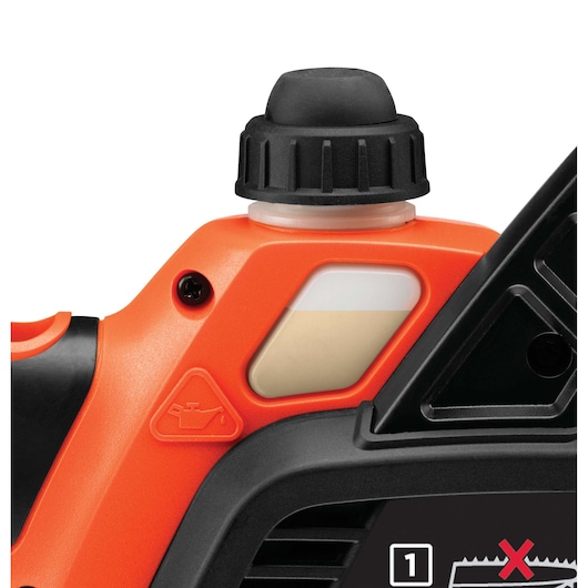 Close-up view of the oil reservoir cap and oil indicator on an orange and black BLACK+DECKER power tool.