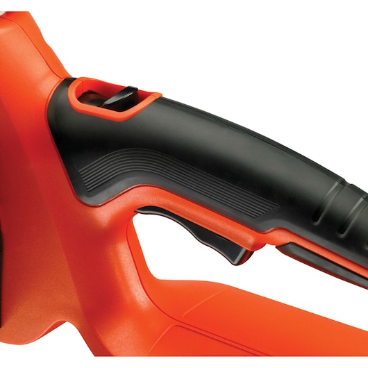 Close-up image of the handle and trigger area of an orange and black power tool, showing ergonomic design and textured grip.