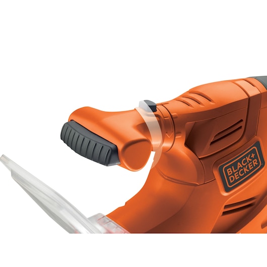 Close-up view of an orange BLACK+DECKER power tool handle with a textured black grip and visible logo.