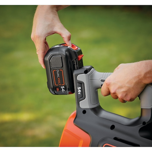 BLACKDECKER GWC54PC photography showing 54V battery installation on outdoor power tool.
