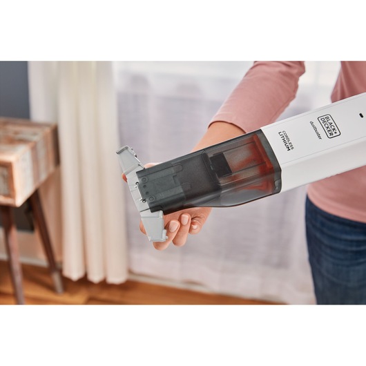 Photo of BLACKDECKER HLVC315B11 cordless lithium handheld vacuum with dustbin being emptied.