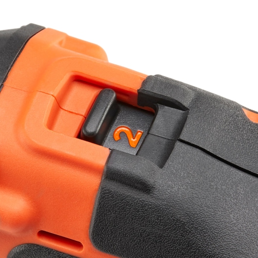 Close-up photo of BLACKDECKER drill speed selector with orange and black details, SKU KFBCD701D1K.