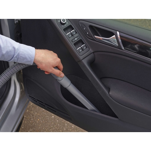 BLACKDECKER NV1210AV car vacuum cleaner cleaning car door pocket, close-up photo, SKU NV1210AV