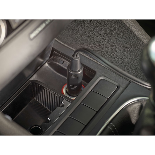 Photo of BLACKDECKER NV1210AV car vacuum cleaner power cord plugged into car socket.