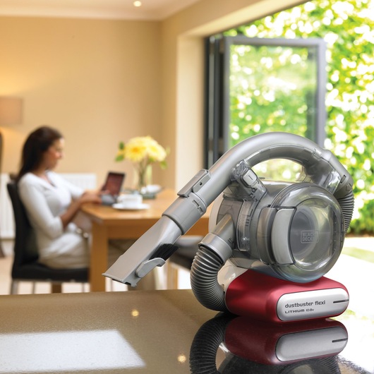 BLACKDECKER PD1020L dustbuster flexi vacuum on countertop in modern home setting.