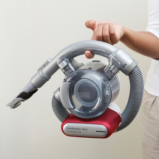 BLACK+DECKER PD1020L handheld vacuum cleaner with grey flexible hose and red base, shown held in hand.