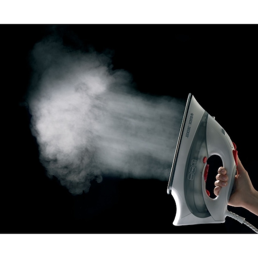 Photo of BLACK+DECKER steam iron XT2030 emitting steam, side view on black background.