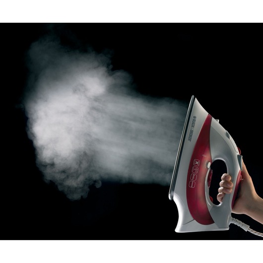Photo of BLACKDECKER steam iron XT2040 emitting steam, showing red and white design against black background.